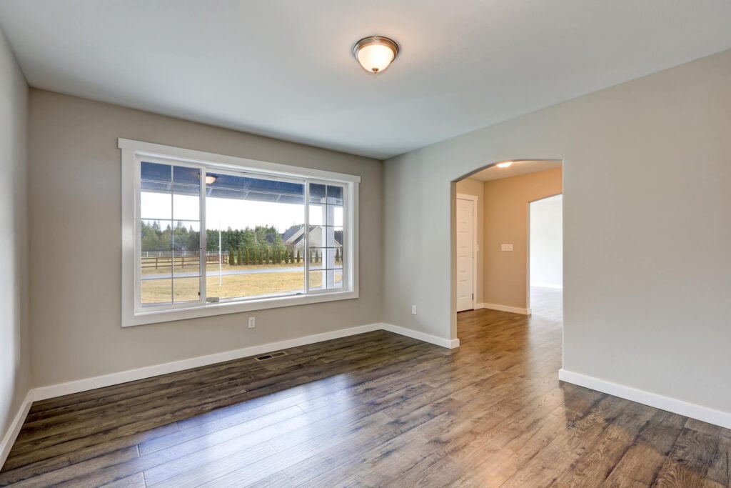 A room with a window and hardwood floor- house painters in Topeka, KSHow to Match Wall Color with Wood Floor in Olathe, KSHow to Match Wall Color with Wood Floor in Olathe, KS