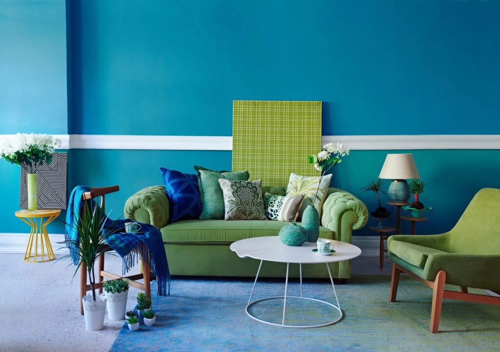 Interior living room with teal painted walls and clean white trim by an interior painter in Lawrence, KS