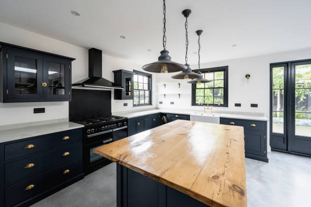 Navy blue cabinets with matching trim by cabinet painting in Leawood, KS