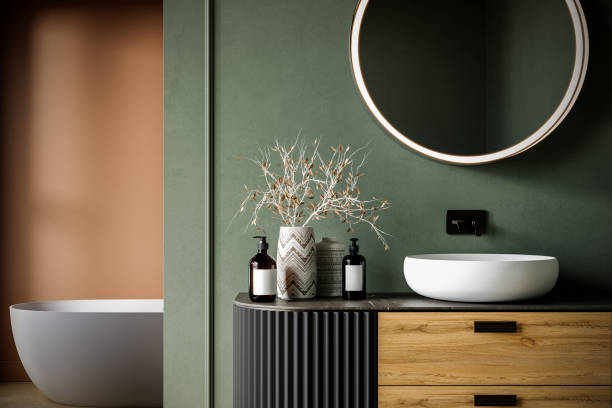 Bathroom with sage green painted walls and minimalist finishes by an interior painter in De Soto, KS.