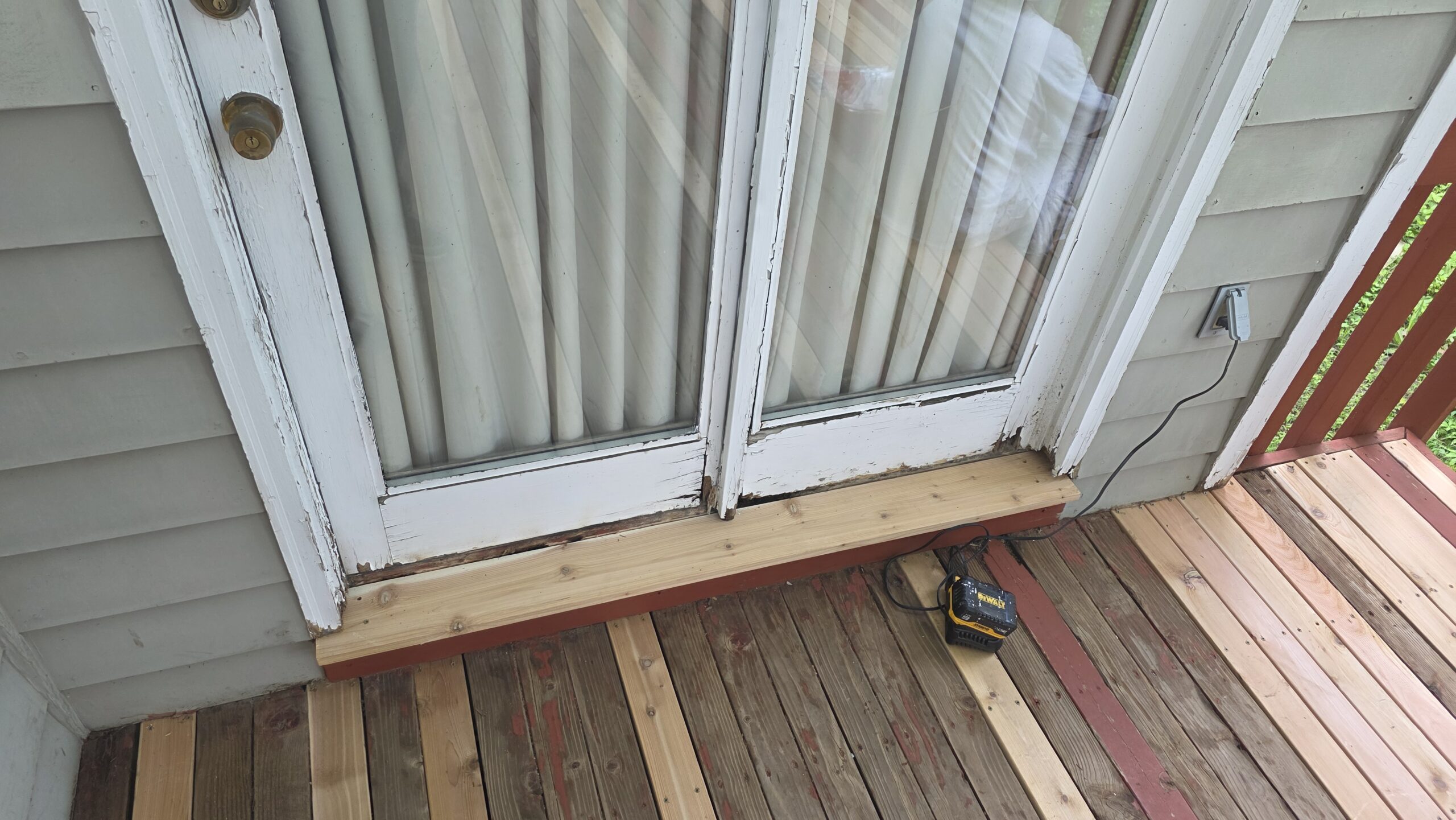 Wood rot repair on a deck and door frame in Topeka