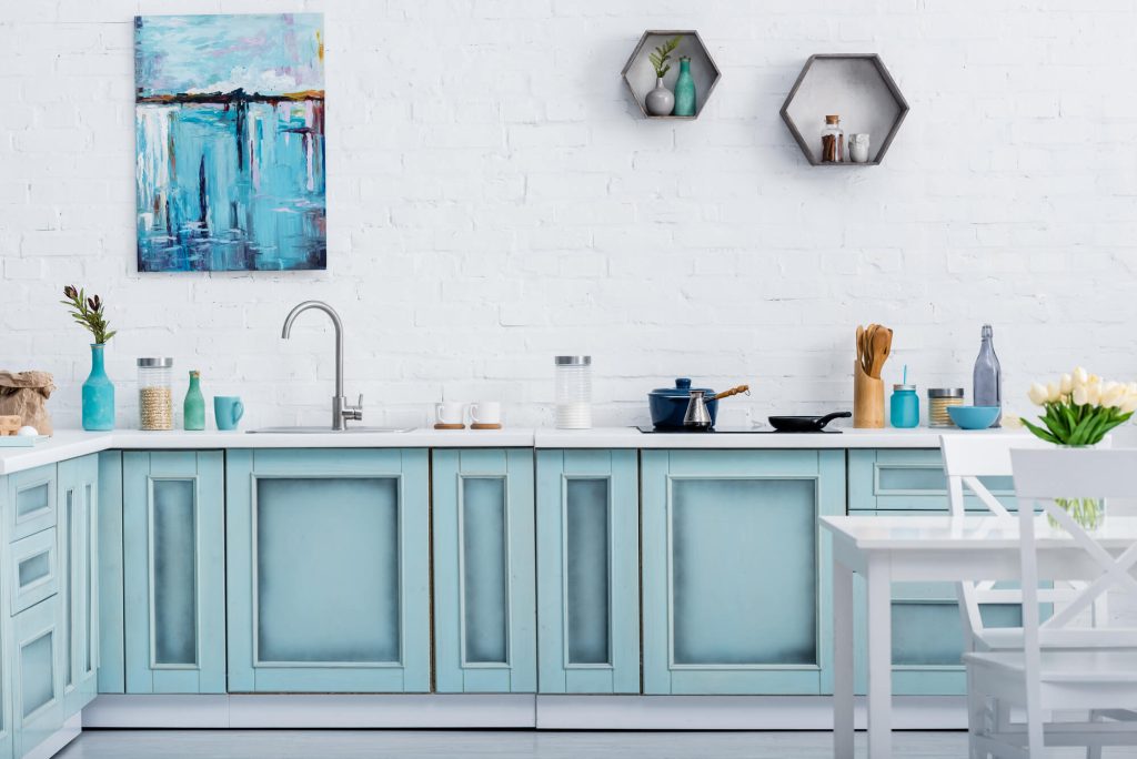 Sink area with sky blue painted cabinets- cabinet painters in Lawrence, KS
how to sand cabinet doors for painting